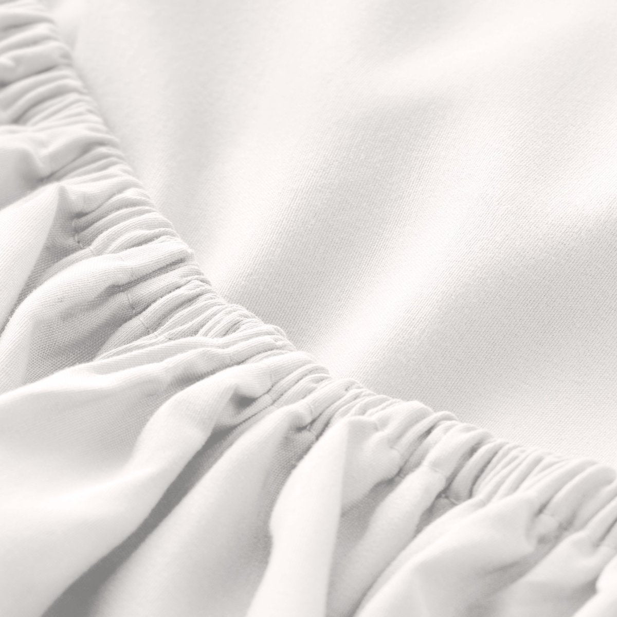 Close-up of fitted sheet with all around elastic