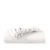 Microfiber fitted sheet folded with a white background