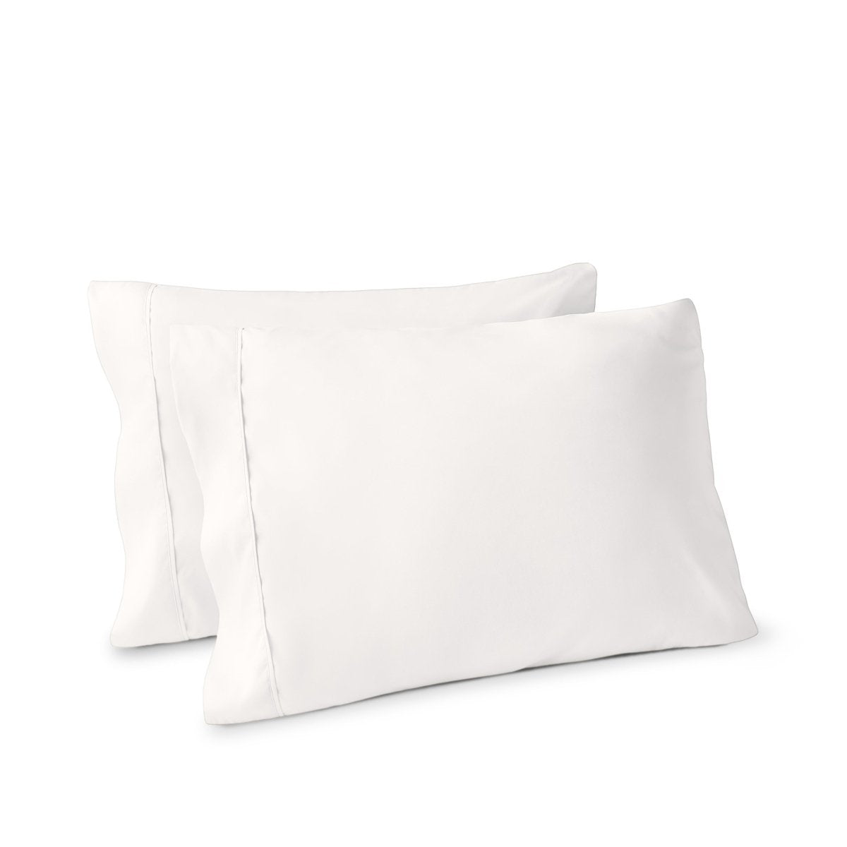 Two pillows on a white background with pillowcases on them