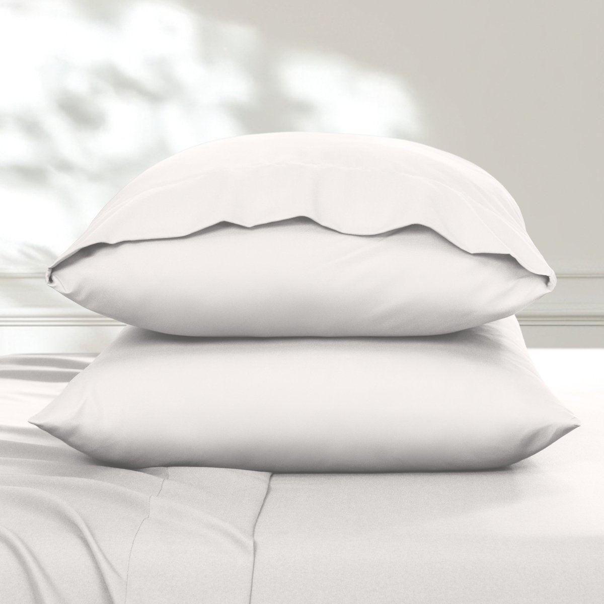2 pillowcases on pillows