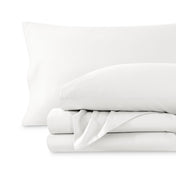 A sateen sheet set folded and stacked on a white background.