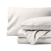 Organic flannel bed sheets and pillowcase set on a white background