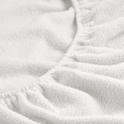 Close-up of a fitted sheet with all around elastic
