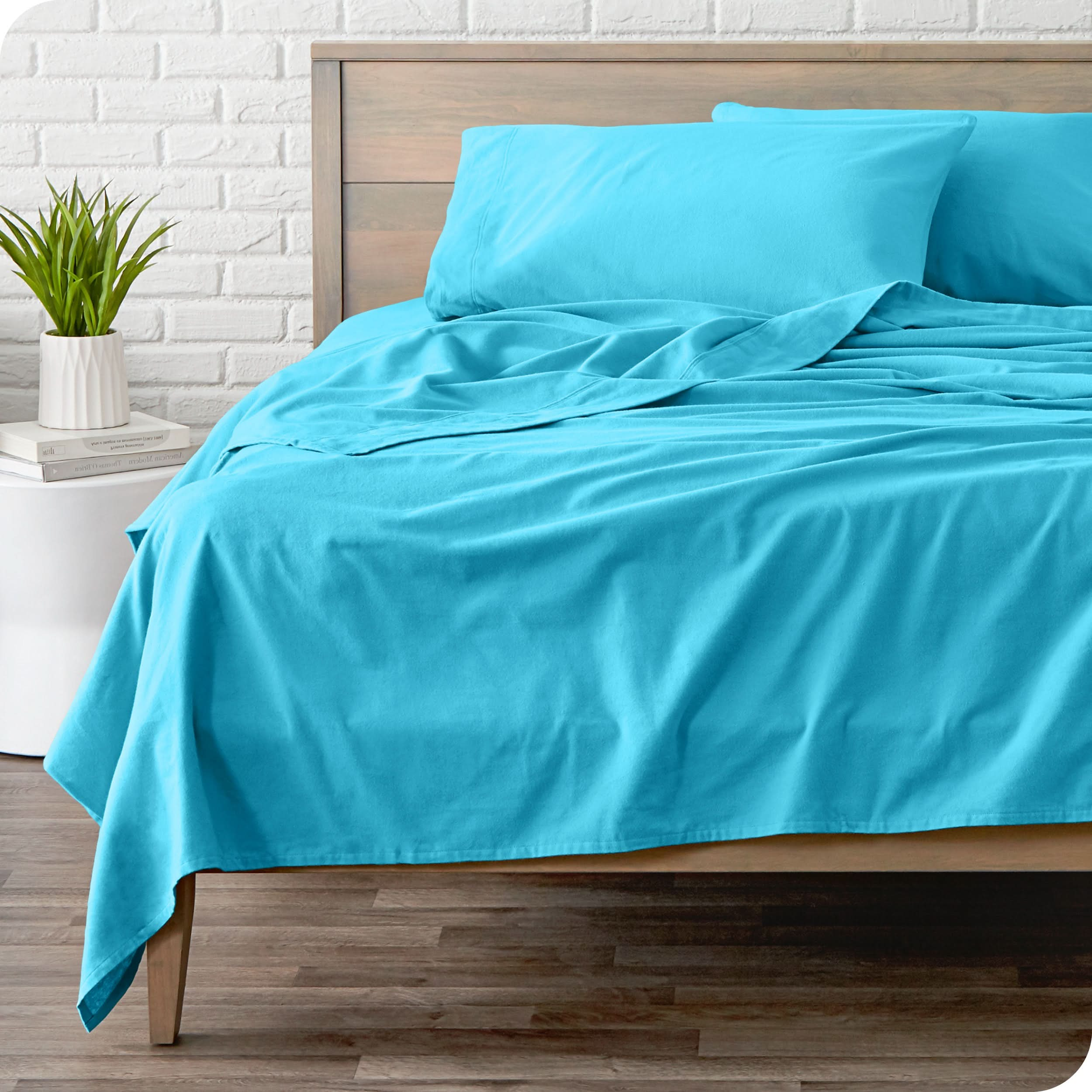 A modern bed with a flannel sheet set on