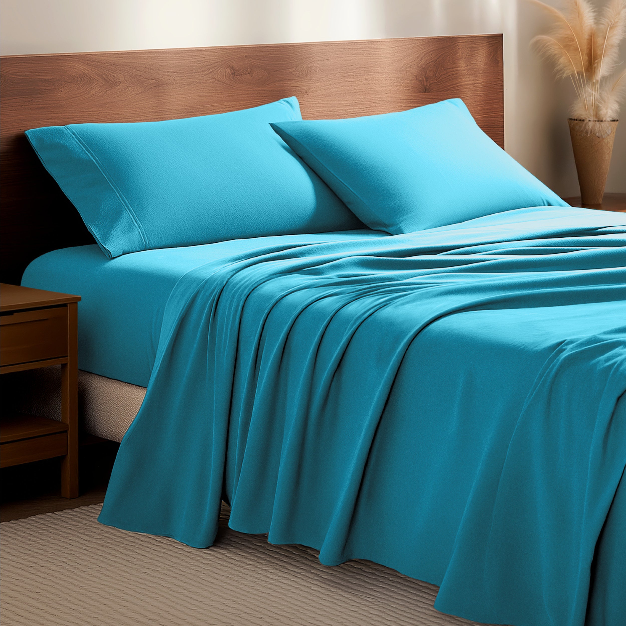 Flannel bedding set on a bed with a wooden headboard and side table