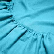 Close-up of a flannel fitted sheet with gathered elastic
