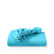 A fitted sheet folded neatly with the all around elastic showing