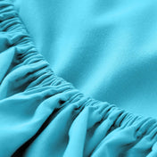 A close-up of a fitted sheet with elasticized edge.