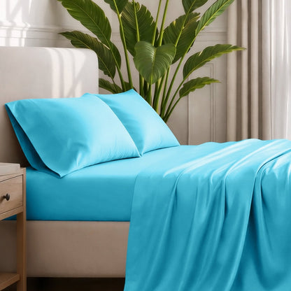 Ultra-soft sheets and pillowcases on a bed with a plant in the background