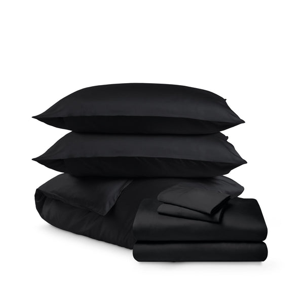 Bedding set including duvet set and sheet set on a white background