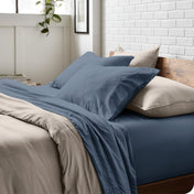 Modern bedroom with washed sheets and duvet cover on a bed