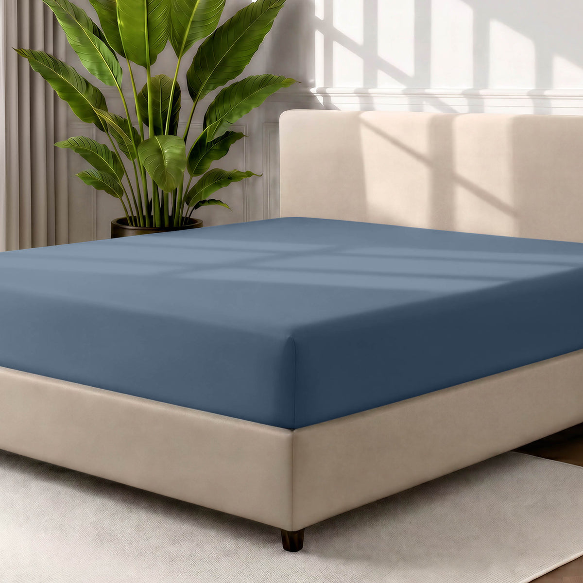 Ultra soft fitted sheet on a mattress with the sun shining into the bedroom