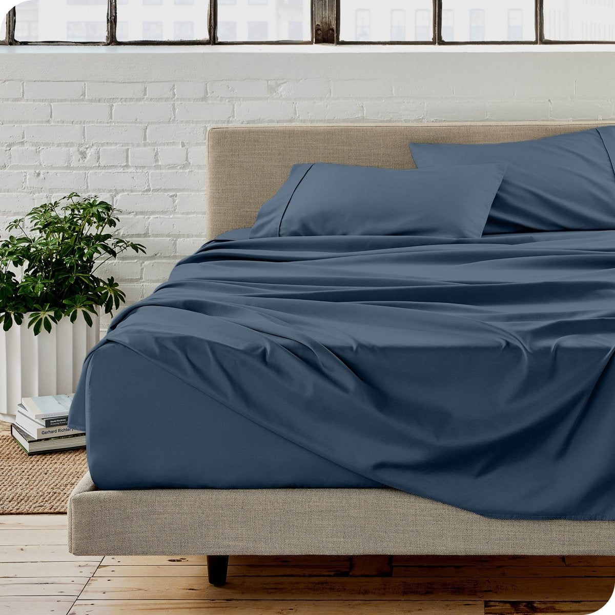 A modern bedroom with microfiber sheets on the mattress