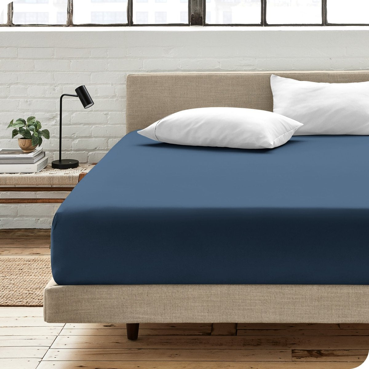 Bedroom scene with organic cotton fitted sheet and pillowcases on a bed