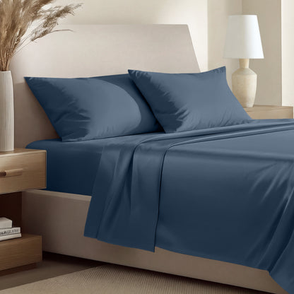 Sateen bedding set including a fitted sheet and two matching pillowcases on a bed.