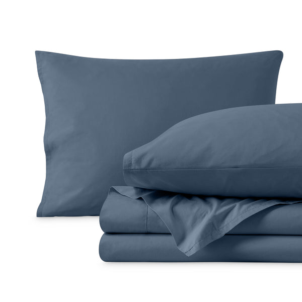 Percale sheets folded and matching pillowcases with pillows in them