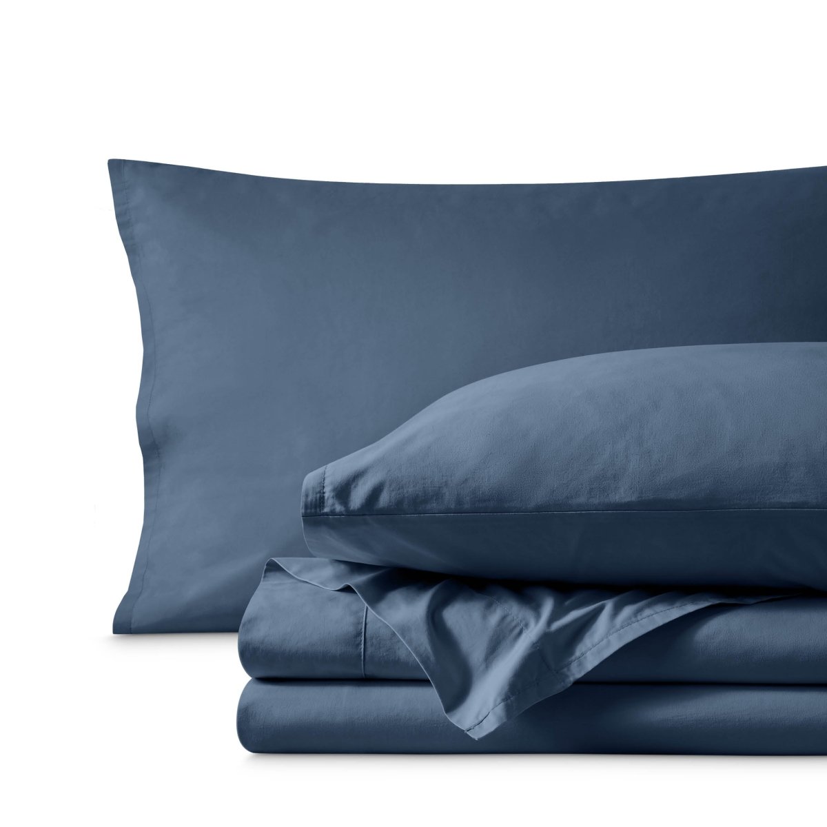 Percale bedding set including pillowcases and folded sheets arranged on a clean white background