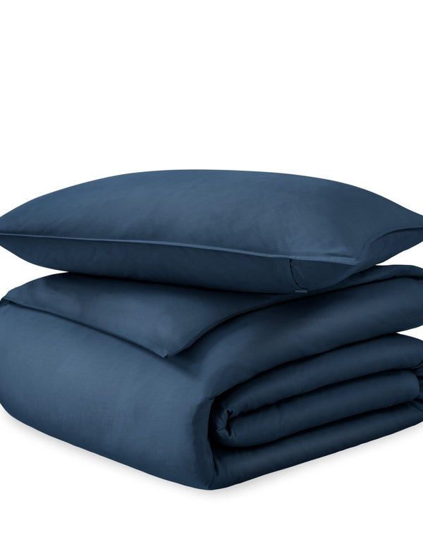A sateen duvet set arranged in a stack