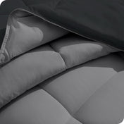 Close up of the comforter folded back showing the two different colored sides