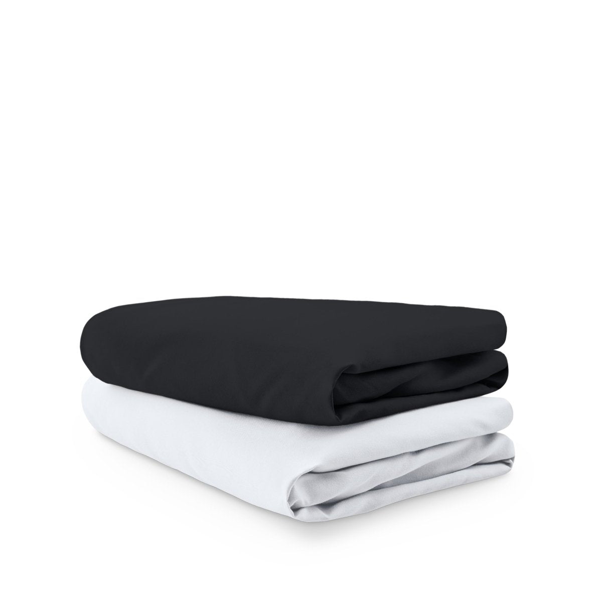 Stack of folded crib sheets on a white background