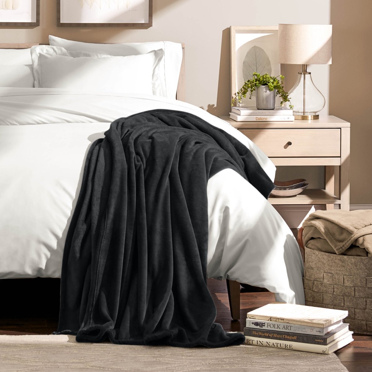 A microplush blanket draped over the corner of a bed
