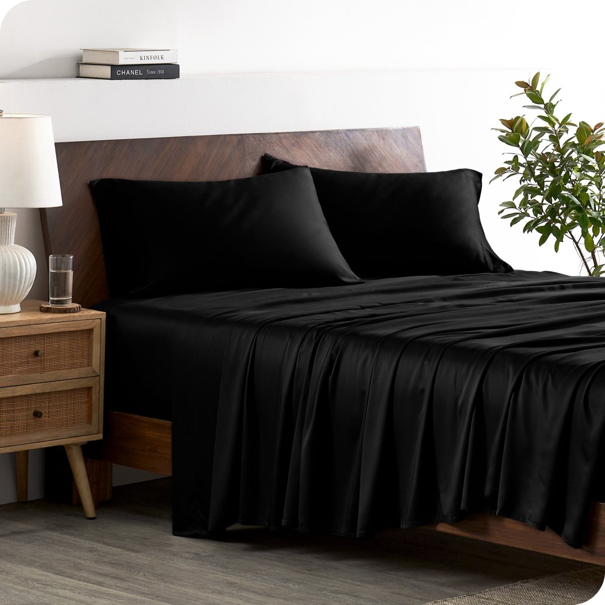 A stylish bed with bamboo sheets and pillowcases, showcasing a sophisticated and elegant bedroom setting.