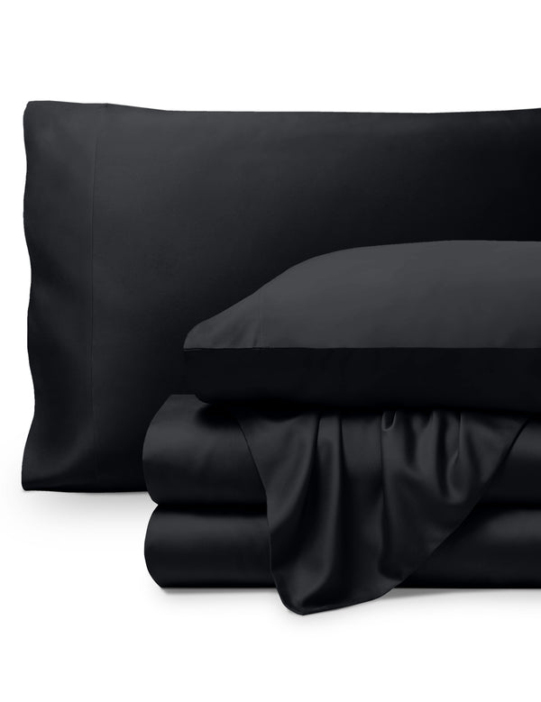 Bamboo pillowcases and sheets set on a white background