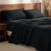 Flannel bedding set on a bed with a wooden headboard and side table