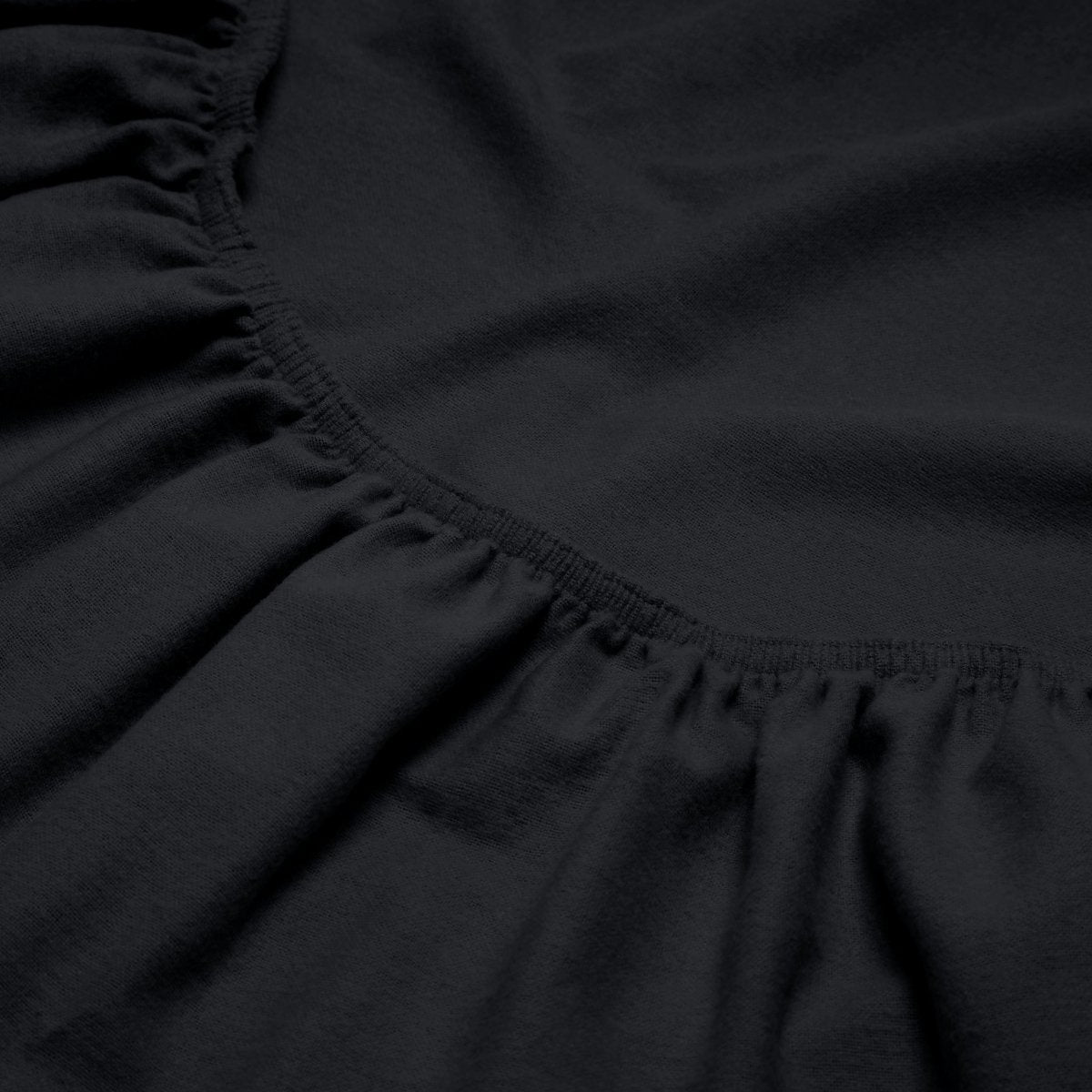 Close-up of a flannel fitted sheet with gathered elastic