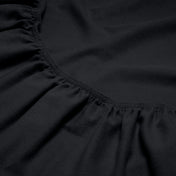 Close-up of a flannel fitted sheet with gathered elastic