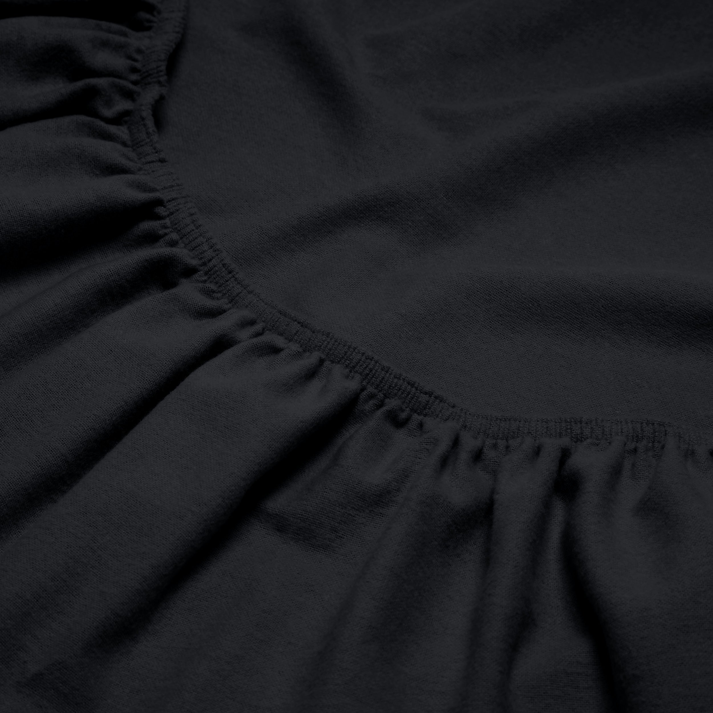 Close-up of a flannel fitted sheet with gathered elastic