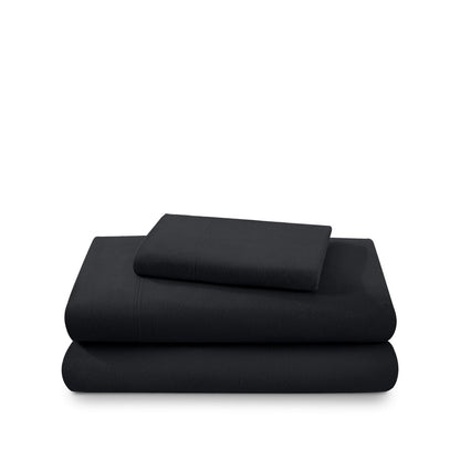 Cotton flannel sheet set folded and stacked on a white background