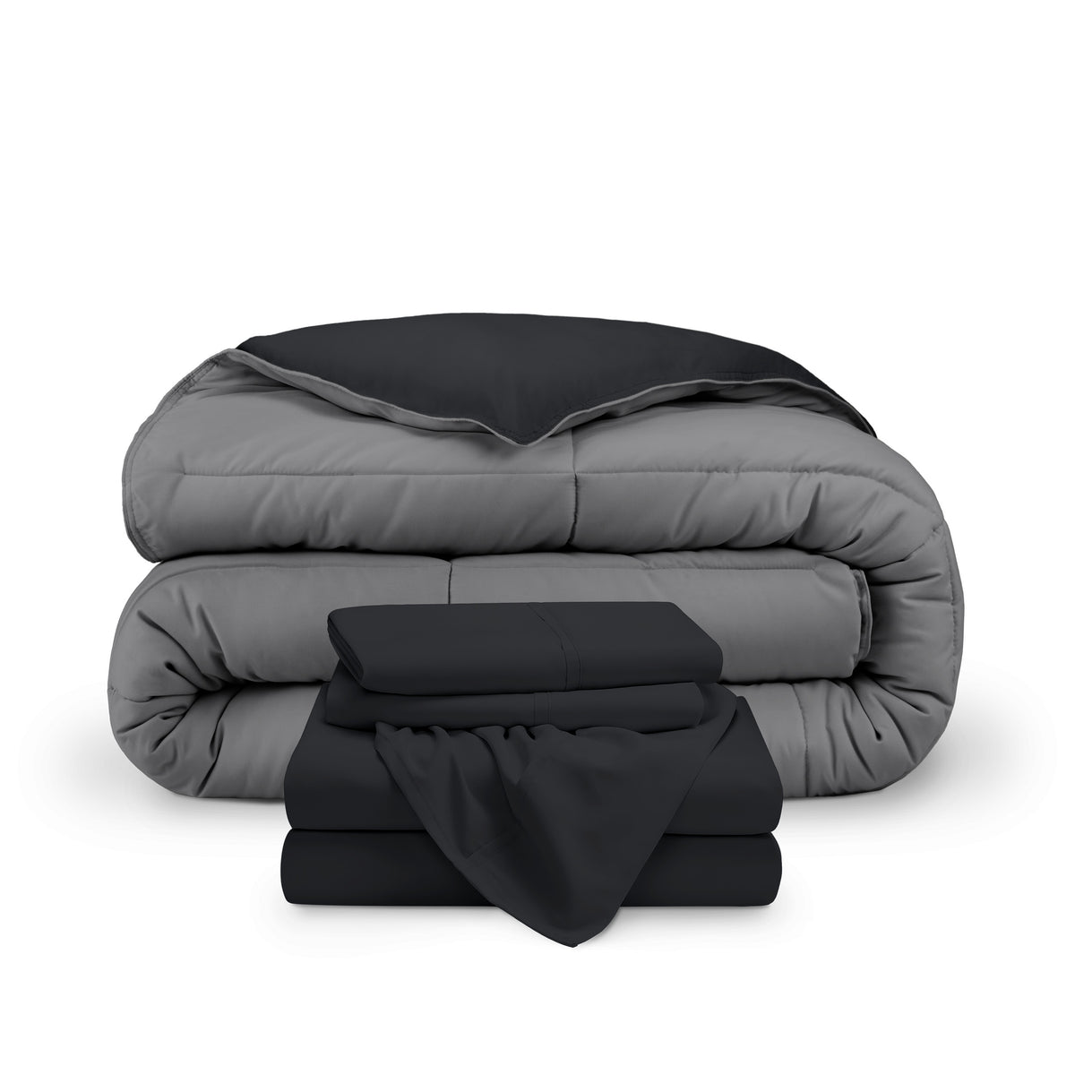 A reversible microfiber comforter and a coordinating sheet set folded and stacked