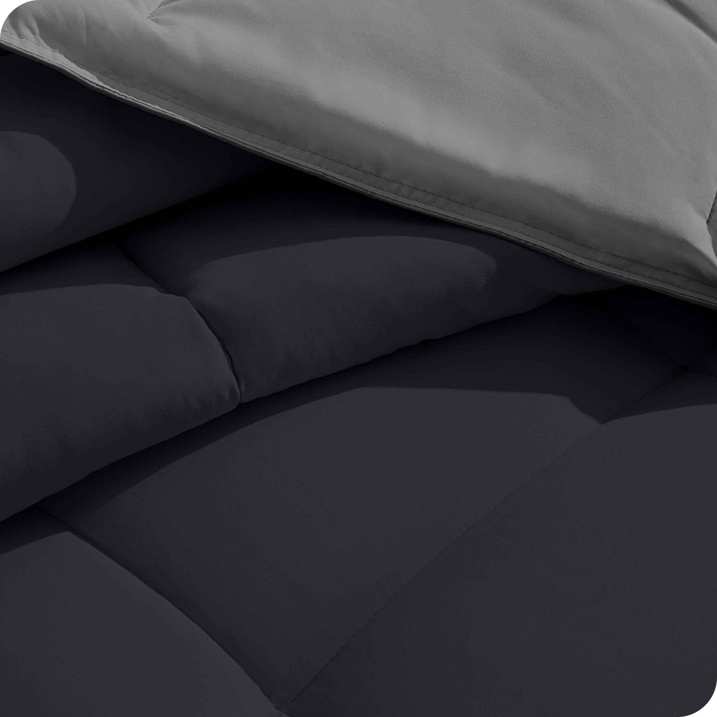 Close up of the reversible comforter showing the box stitching and the two colors