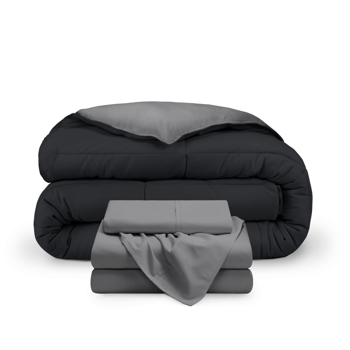 A reversible microfiber comforter and a coordinating sheet set folded and stacked