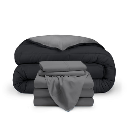 A reversible microfiber comforter and a coordinating sheet set folded and stacked