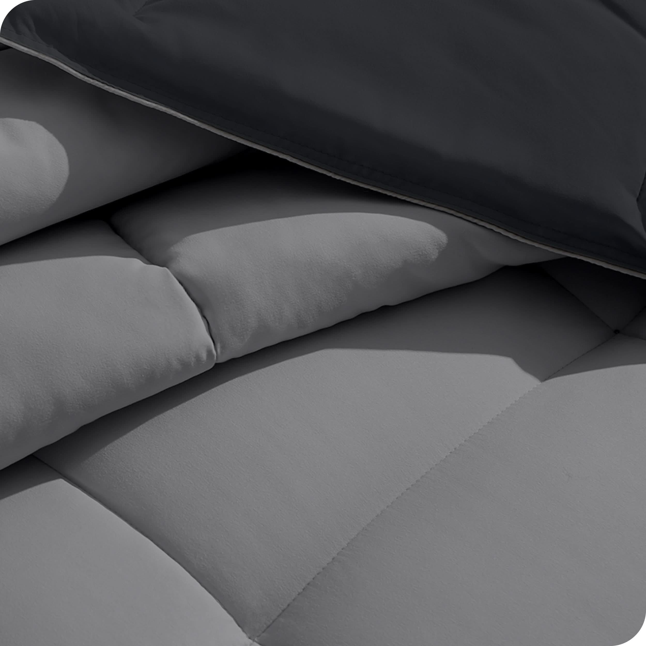 Close up of the reversible comforter showing the box stitching and the two colors