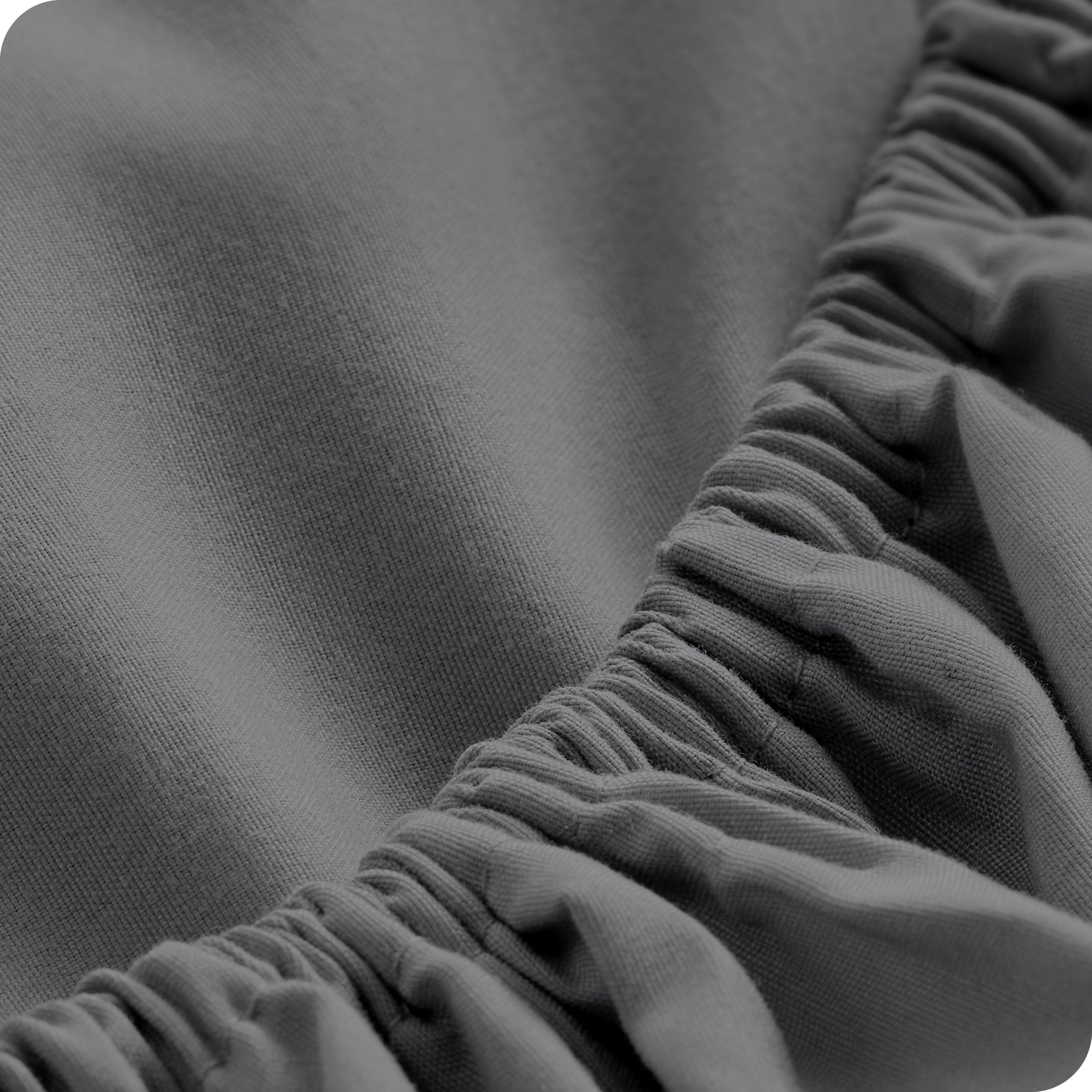 Close up of a fitted sheet with all around elastic