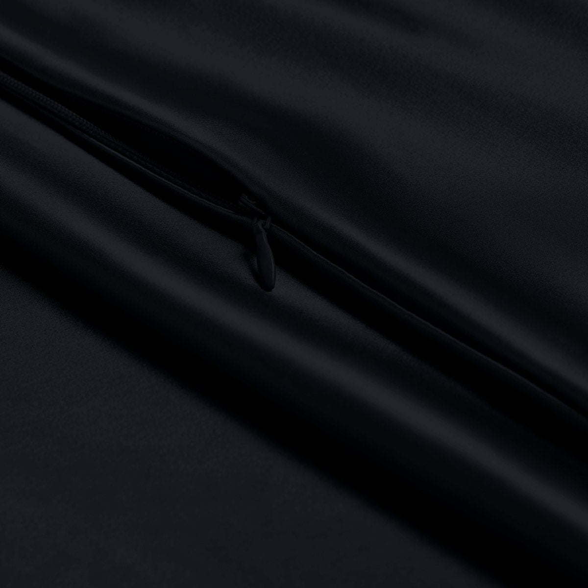 Close-up of a satin pillowcase with a zipper
