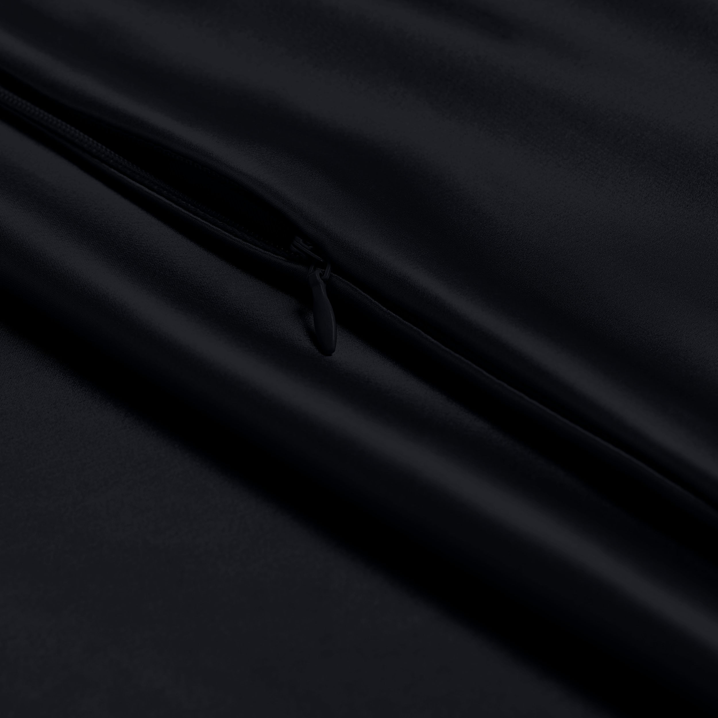 Close-up of a silk pillowcase with a zipper