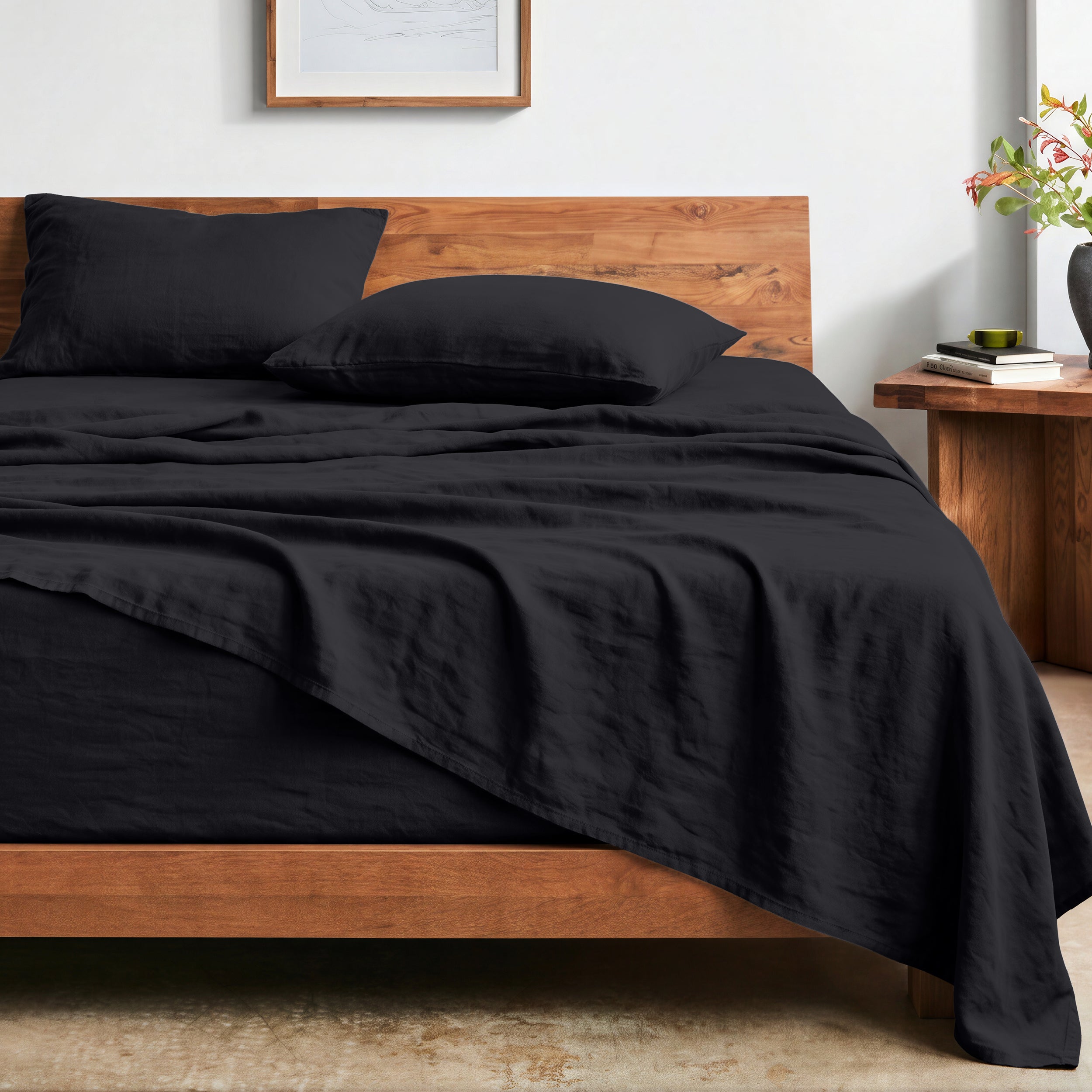 Bed with washed sheets and wooden headboard in a bedroom setting