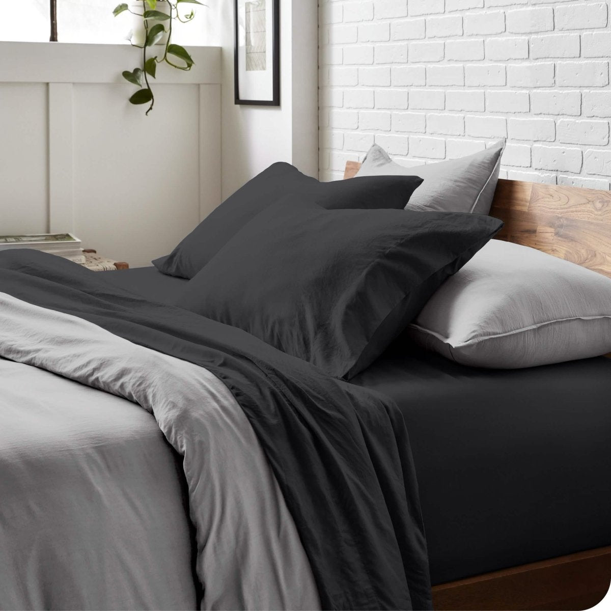 Modern bedroom with washed sheets and duvet cover on a bed
