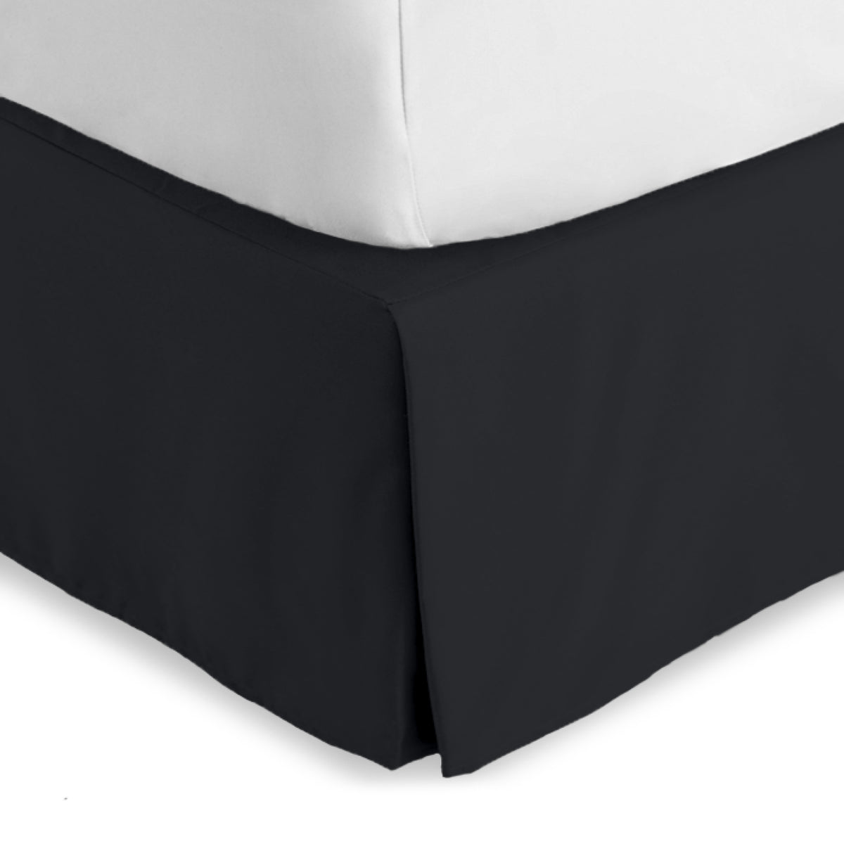 Bed skirt on a bed with white bedding
