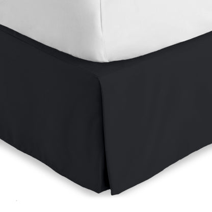 Bed skirt on a bed with white bedding