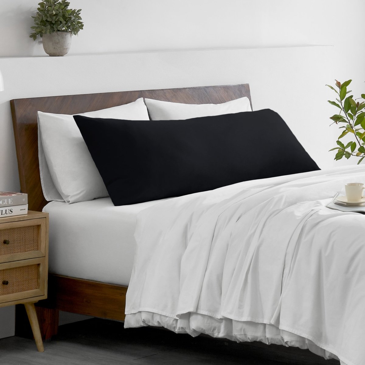 Bed with microfiber bedding and wooden headboard in a bedroom setting