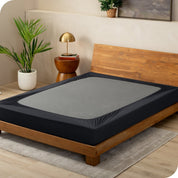 Black box spring cover on a box spring