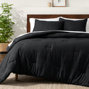 Bedding set on a bed in a bedroom with a side table and lamp.