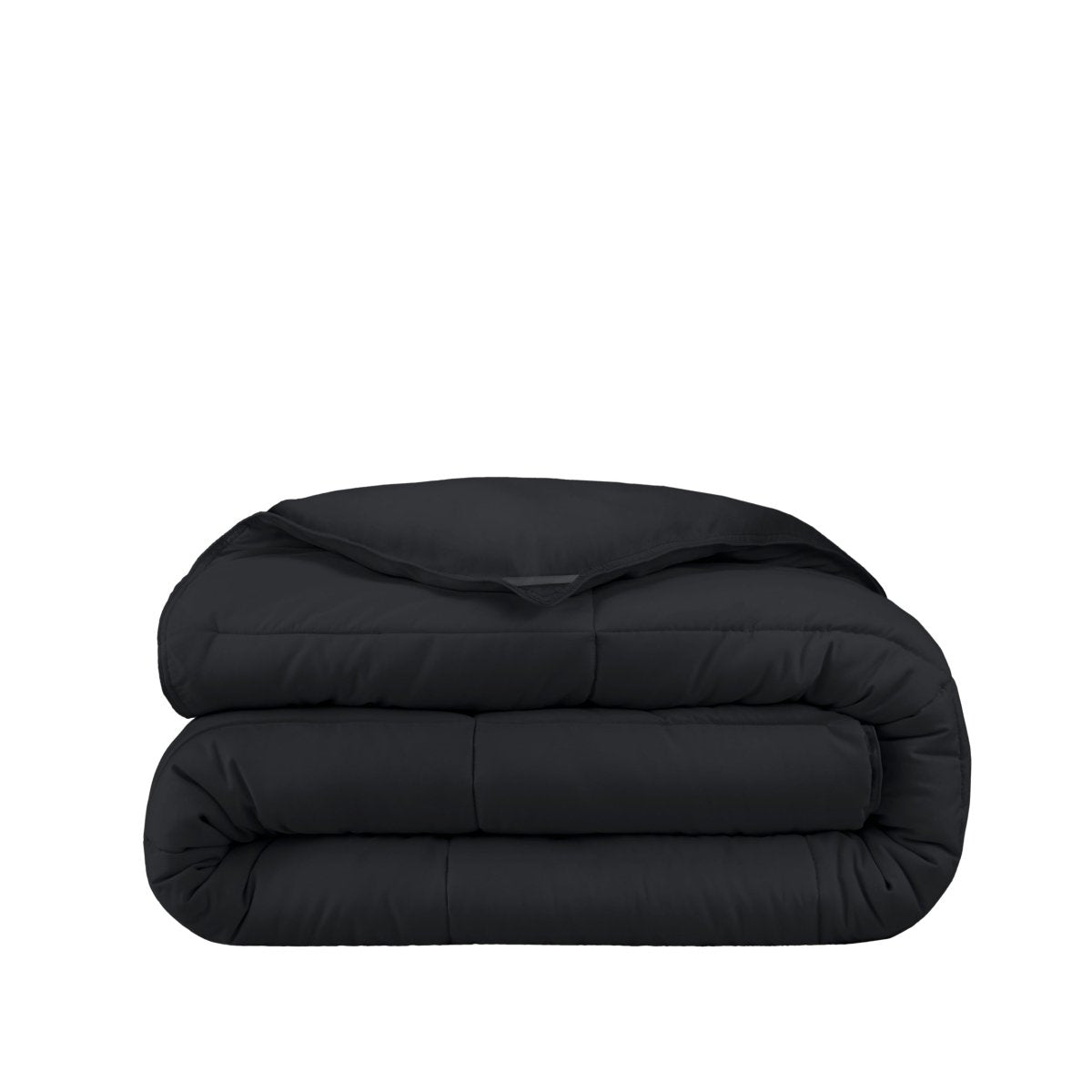 Folded black comforter on a white background
