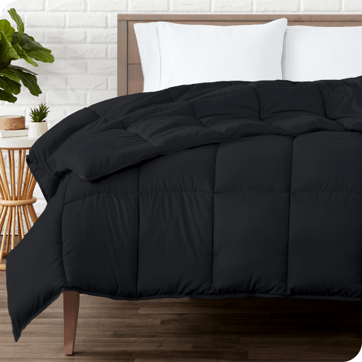 A modern bedroom with a duvet insert on a bed folded back over itself