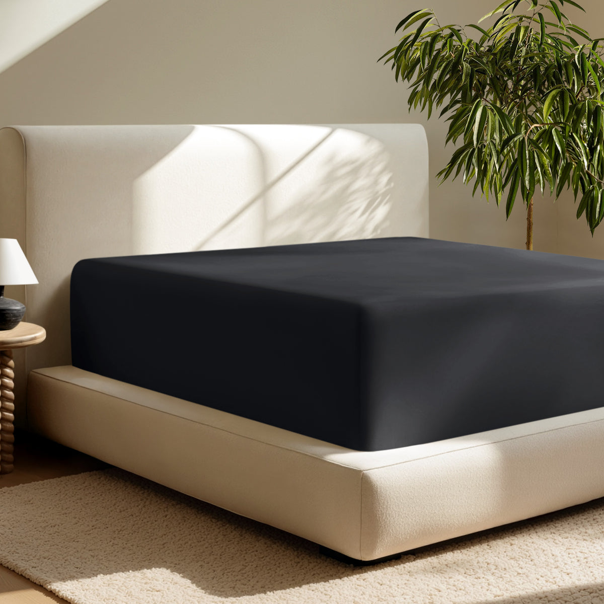 A deep pocket fitted sheet on a mattress